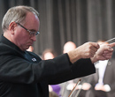 David Littrell and the K-State Orchestra perform a commemorative piece.