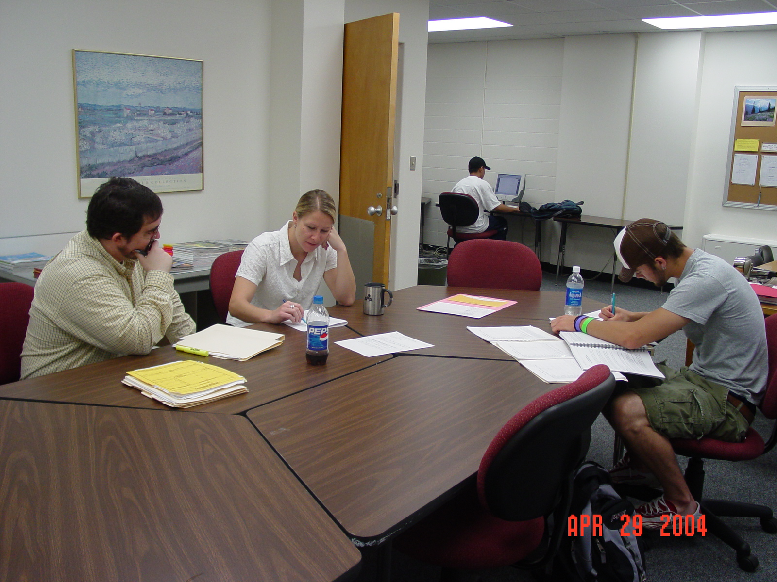 Tiffany, Writing Center tutor, with three students