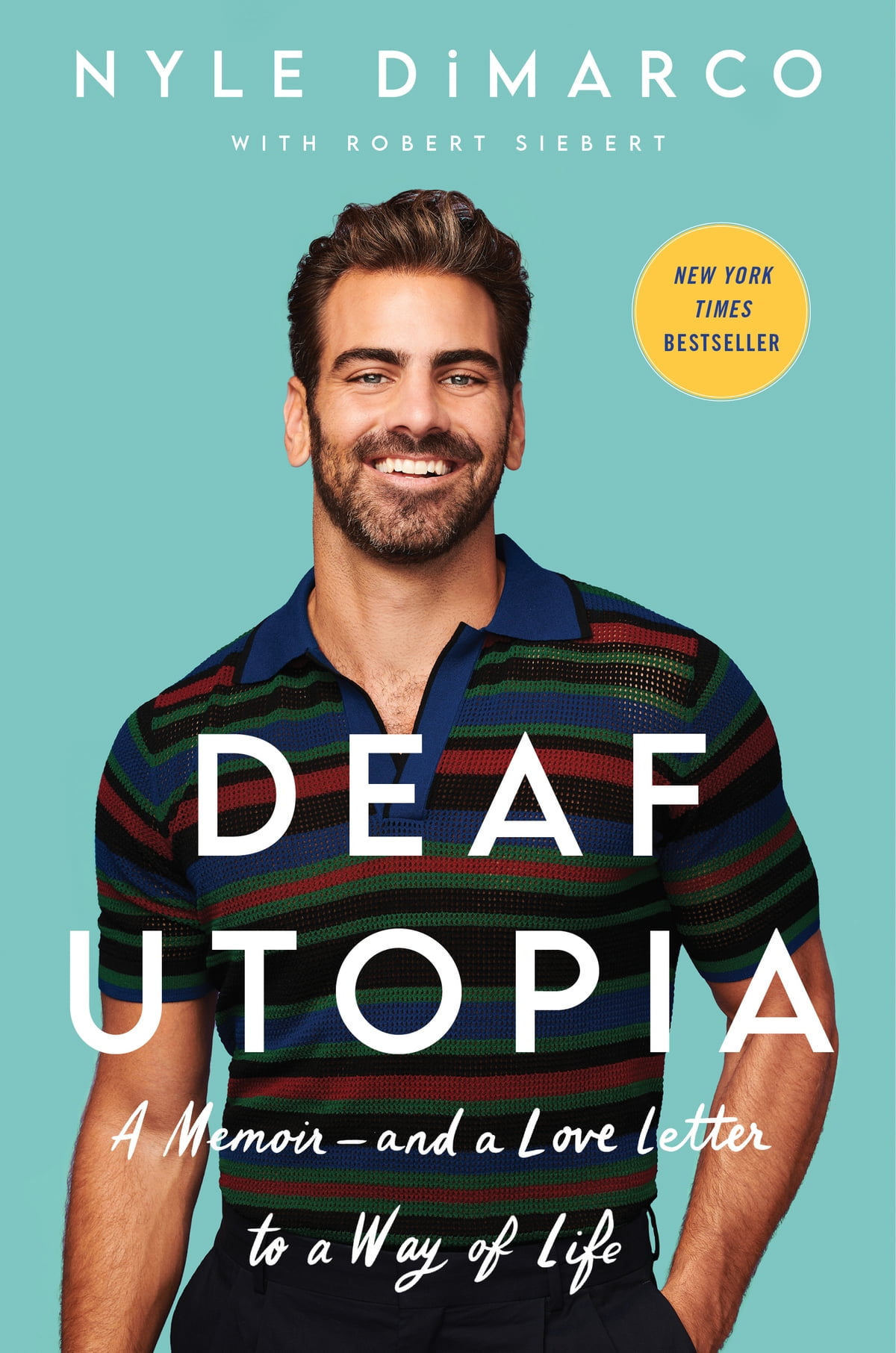 Nyle DiMarco is central on the cover of his book, Deaf Utopia. He smiles at the camera