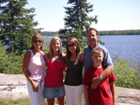 The Schneiders, on vacation at Barber's Resort in Minaki, Ontario. Pictured from left-to-right are Denise, daughter Emily, daughter Elizabeth, Rob and son Will.