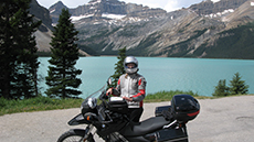 April Mason with her motorcycle in the mountains