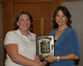 Cheryl Boyer (left) receiving her award from Kris Boone, department head