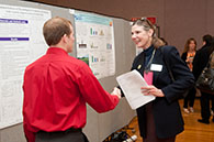 April Mason talking with student researcher
