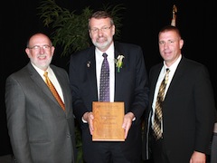 Daryl Buchholz was honored with the Epsilon Sigma Phi (ESP) Distinguished Service Ruby Award at the Galaxy IV Conference. Pictured (L-R) are Mark Stillwell, current ESP national president; Buchholz; and Justen Smith, past ESP national president.