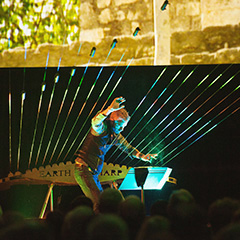 William Close playing earth harp
