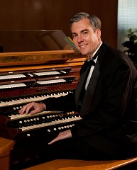 David Pickering at All Faiths Chapel organ console