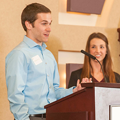 Kansas State University management student Samuel Marshall accepts the Mentee of the Year award at the Executive Mentor Appreciation Luncheon.