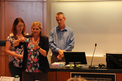 Trainers Brandi Miller, Dave Fairfield and Cassie Jones perform a demonstration on supplier verification. 