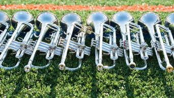 Trumpets line the football field at Bill Snyder Family Stadium 