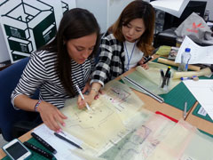 Kansas State University interior design student works with a student from Inje University during a workshop in South Korea