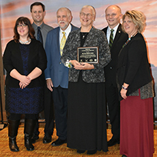 Beth Drescher with award