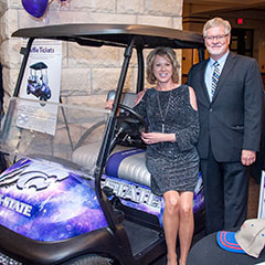 Jodi and Jon Prescott, winner of the customized K-State Themed Golf Cart raffle