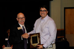 Ernie Minton (l.) interim College of Agriculture dean congratulates Associate Agronomy Professor Ignacio Ciampitti