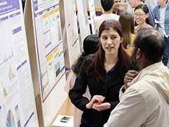 Second-year student Meghan Lancaster explains her poster research project