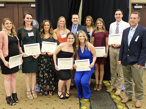 Students pose with their awards