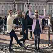 K-State Education Abroad students Adam Cook, Bailey Short and Katy Fink make a "KSU" in front of Buckingham Palace in London, England in March, 2020.