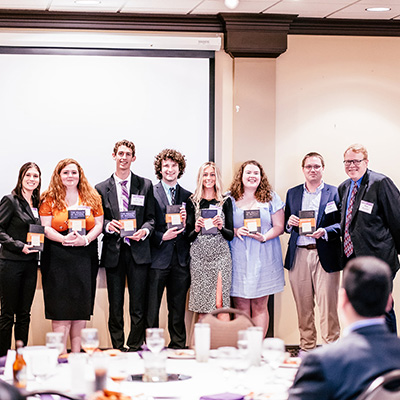 Outstanding Seniors with their gifts from the department