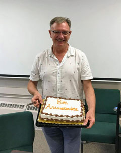 Bob Clark enjoying a birthday cake in Eisenhower Hall