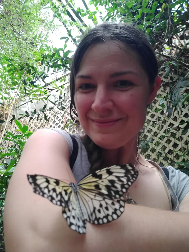 Portrait of Nicole Kucherov with butterfly.