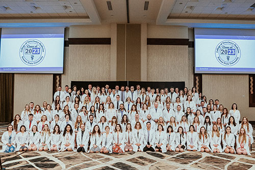 The class of 2023 poses after receiving the students received their White Coats.