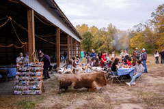 Under a canopy of twinkling lights, community members gather, share, and celebrate the collective effort towards creating brighter futures at the Habitat Hoedown.