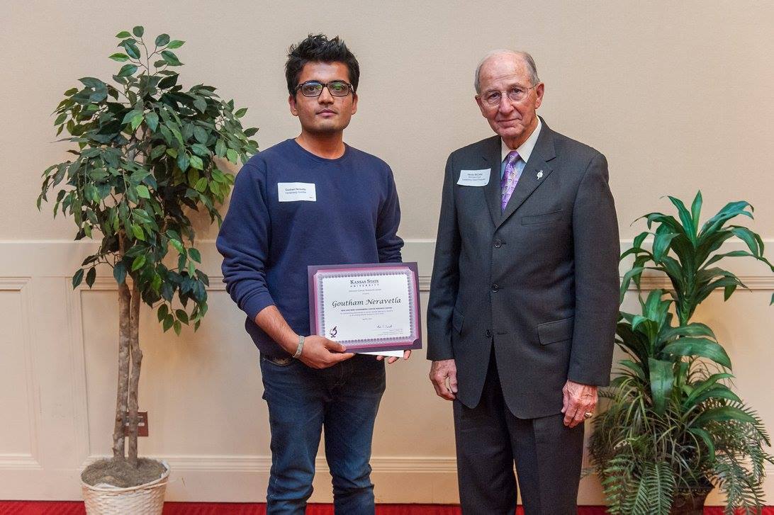 Goutham Neravetla recieving the Riva and Mike Vandenberg Award from Harvey McCarter