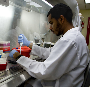 Mychal Davis pipetting in the lab