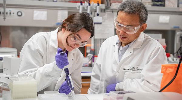 researchers in a lab