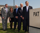 Schulz poses in front of the Biosecurity Research Institute with Congresswoman Lynn Jenkins, BRI Research Director Stephen Higgs, Senator Pat Roberts, and U.S. Secretary of Agriculture Tom Vilsack.