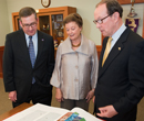 Schulz peruses the St John's Bible with Mary Lynn and Warren Staley, whose donation helped secure the creative work for the university's collection.