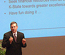 Kirk Schulz presenting before a K-State open forum.
