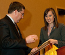 Lydia Peele, student body president, presents a plaque to Dr. Schulz.