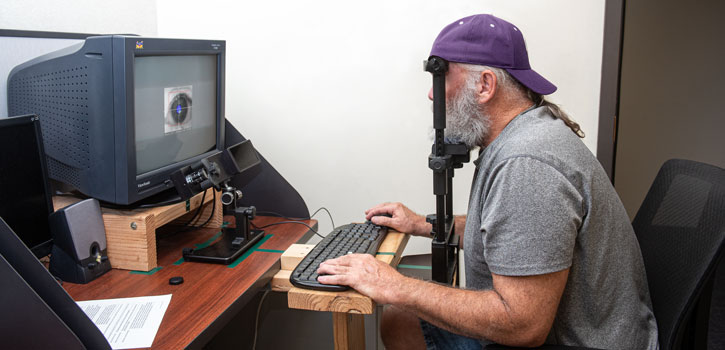 A participant uses eye tracking technology