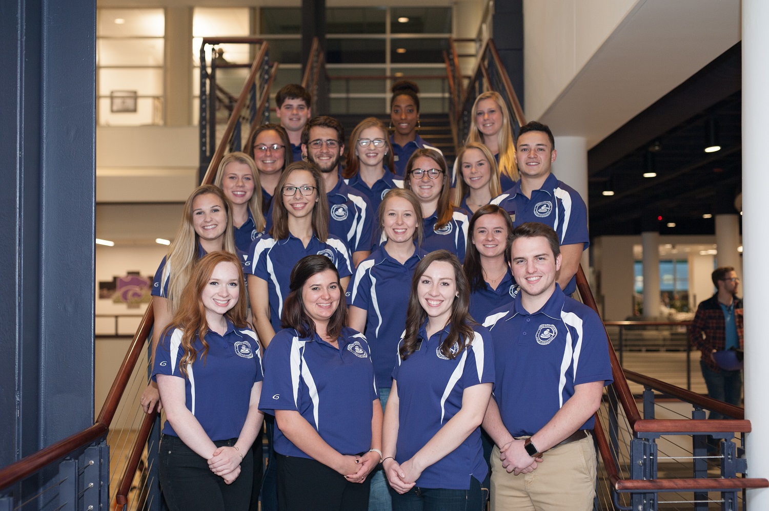 A group photo of the Pre-Law Ambassadors in matching blue polo shirts.