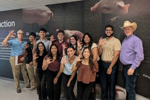 A group of K-State students meet with two of Cargill's leadership during a networking event.