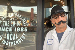 K-State faculty member and CAT Community instructor dons a costume outside of the Dusty Bookshelf in Manhattan, KS.