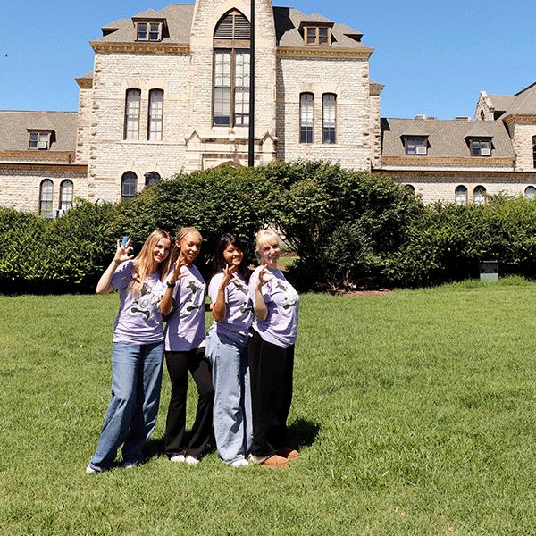 Four members of the 2026 MAPS program stand in front of Anderson Hall.