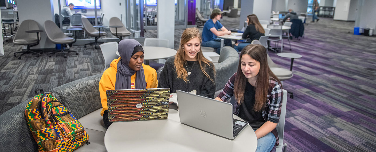 Three female students studying together.