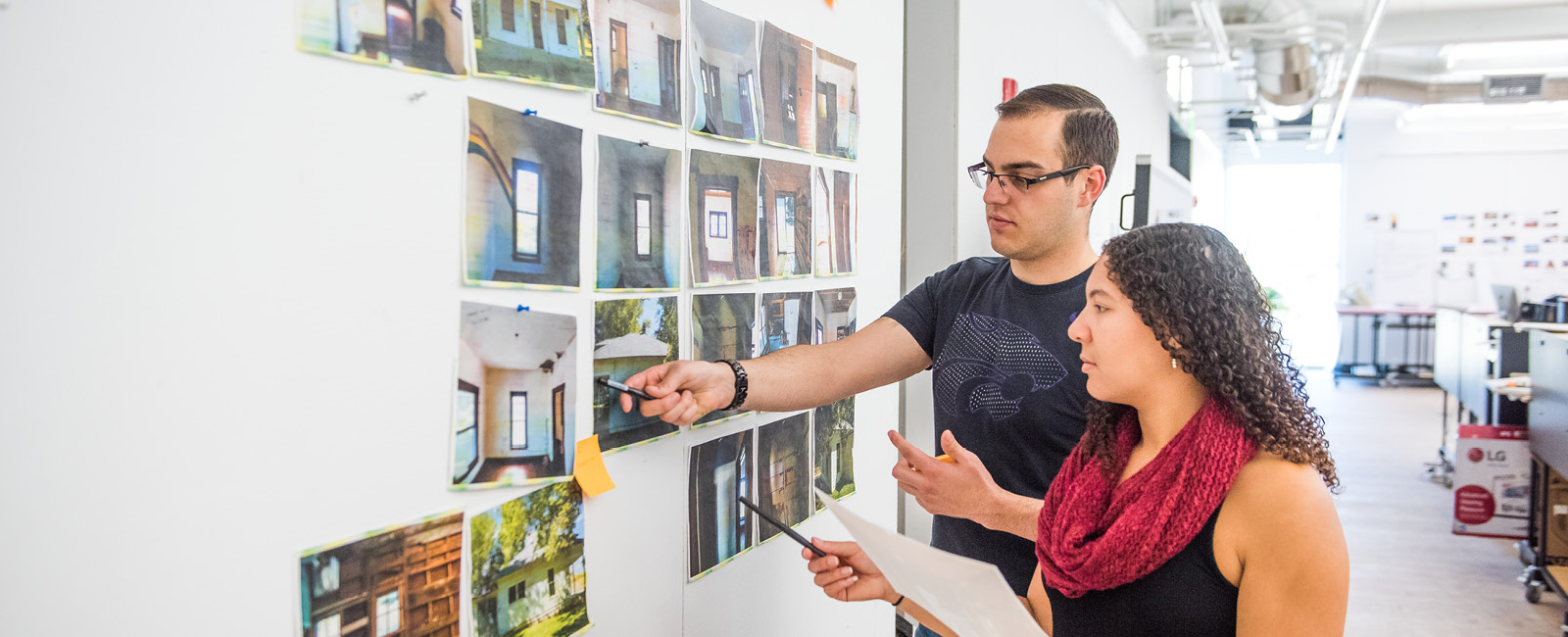 Students looking at architecture photos