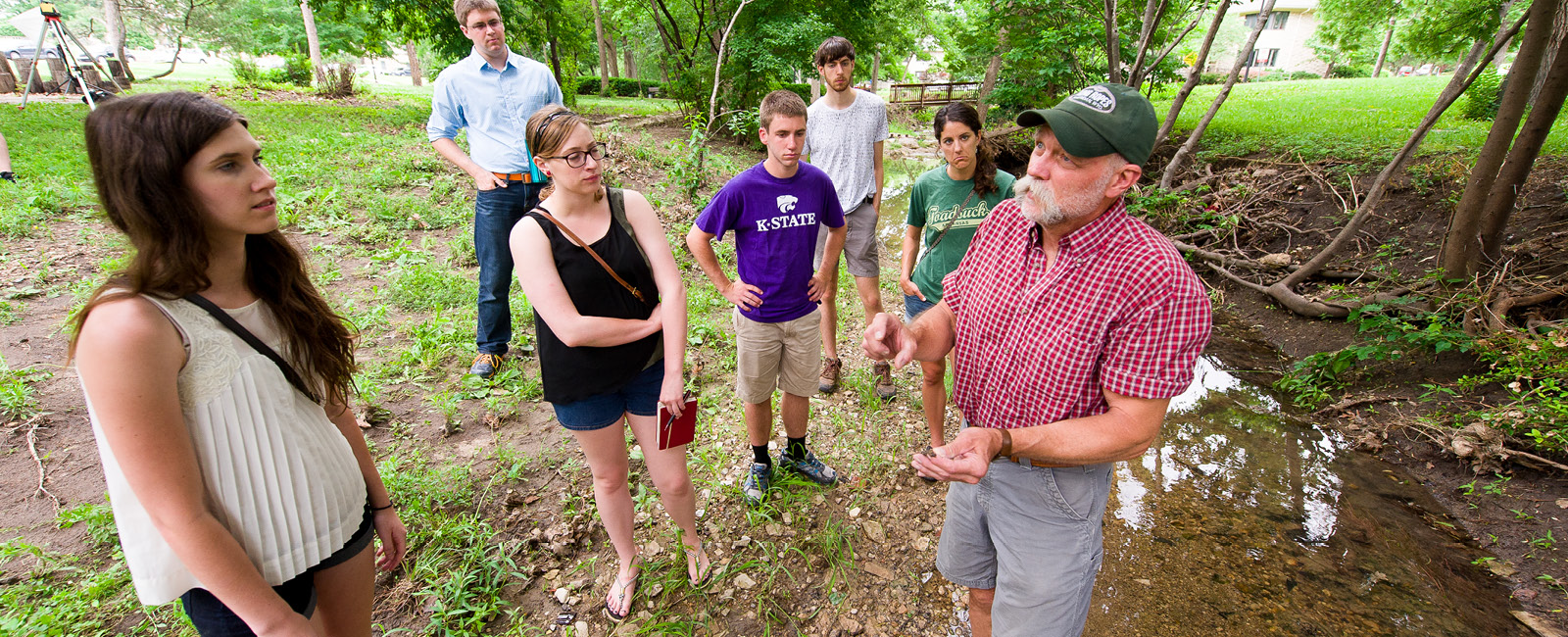 Students surveying land on campus