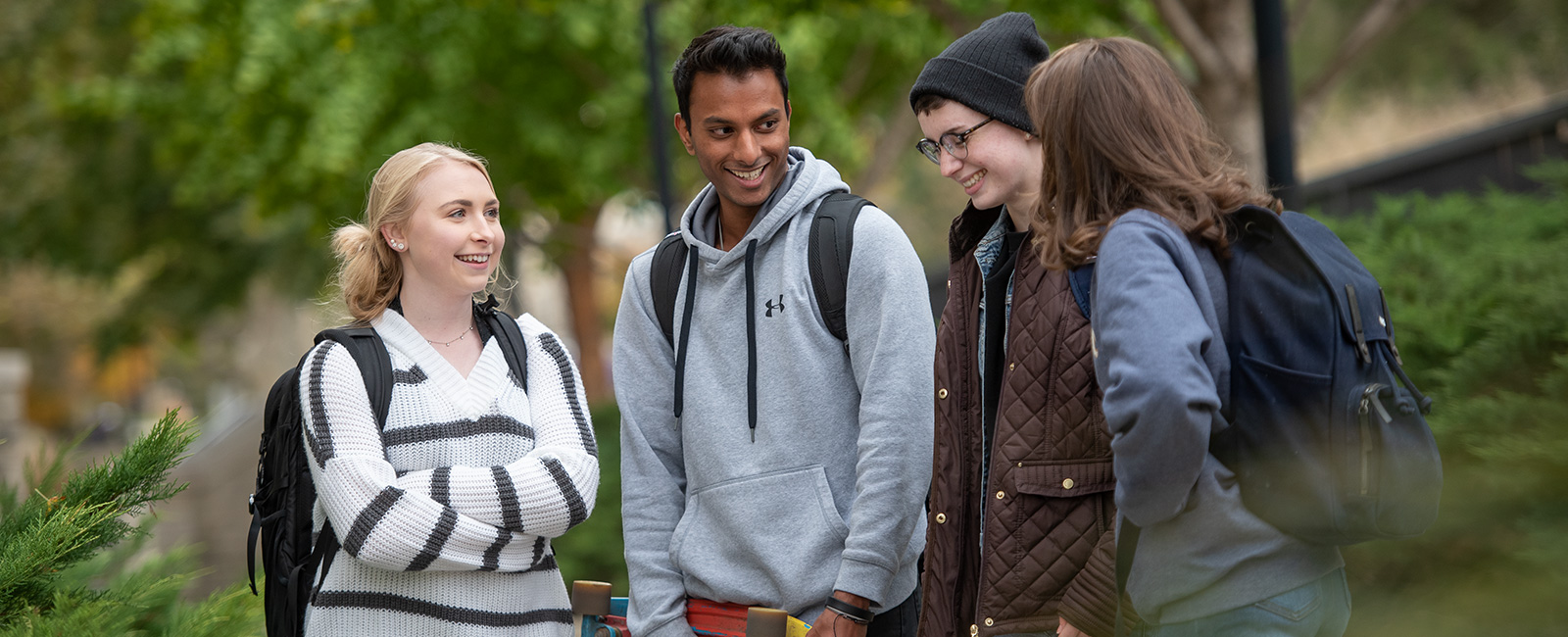 Students talking outside on campus