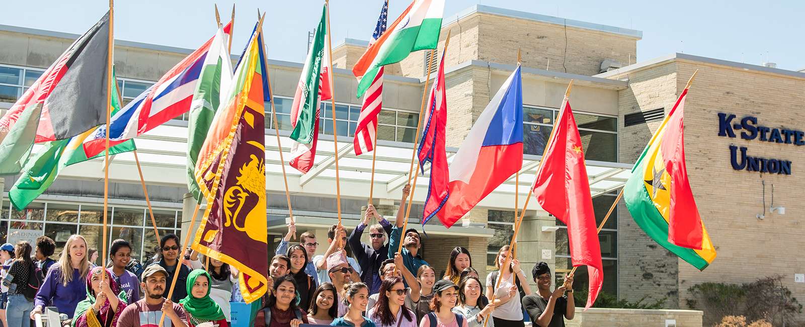 Students with international flags on campus