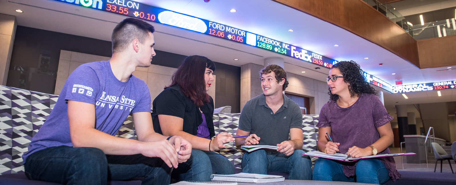 Students working in group in the College of Business building