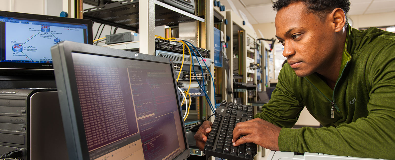 Student working in electrical engineering system