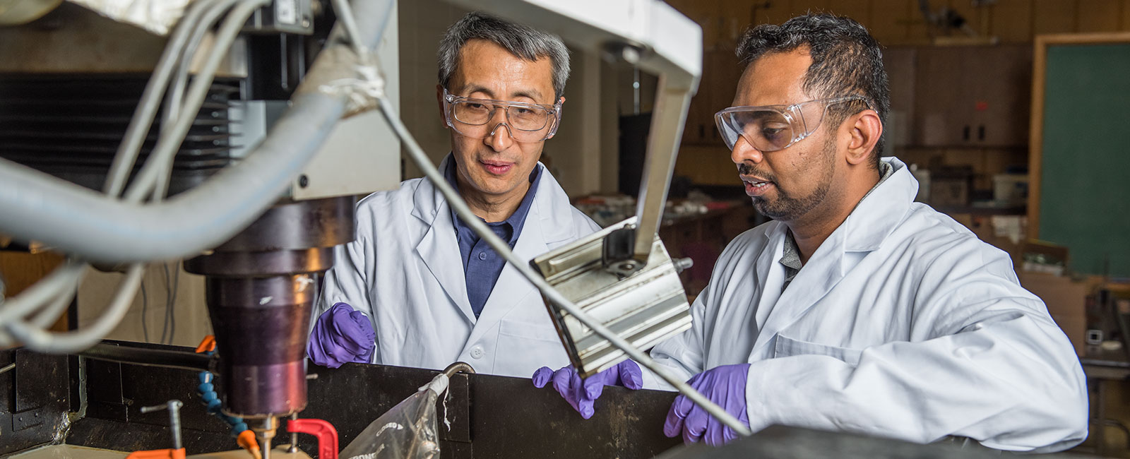 Professor and student working in lab