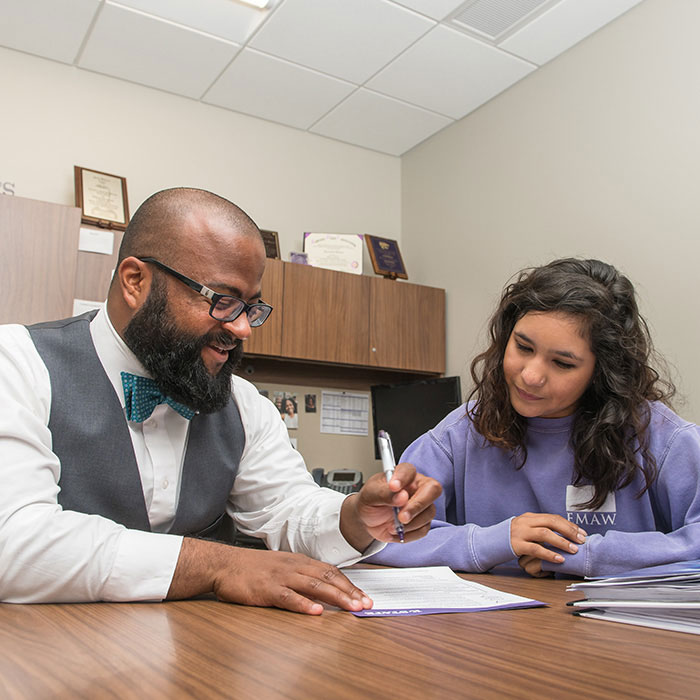 Advisor assisting a student with degree program choices.