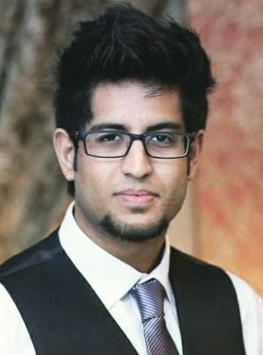 Portrait of Hasan in business clothes