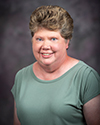 a woman in a green shirt