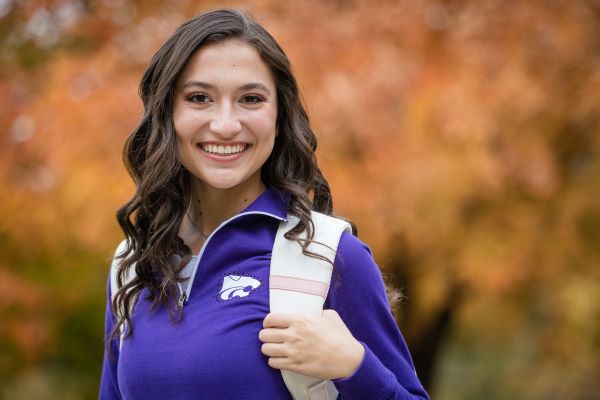 Smiling female student with a backpack.