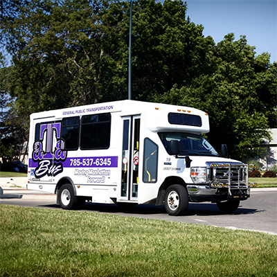 Image of a K-State ata bus, which seats about twenty passengers.